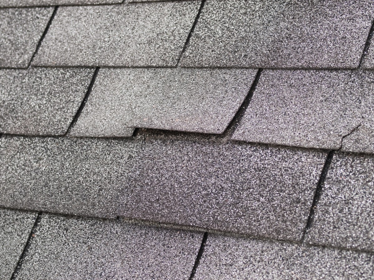 Repairing a Leaky Roof's Curled Shingles