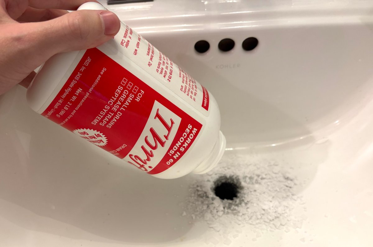Person pours Thirft drain cleaner down bathroom sink.