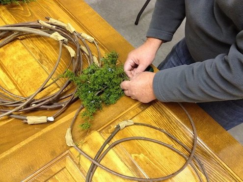 Starting the wreath with a piece of fresh cedar