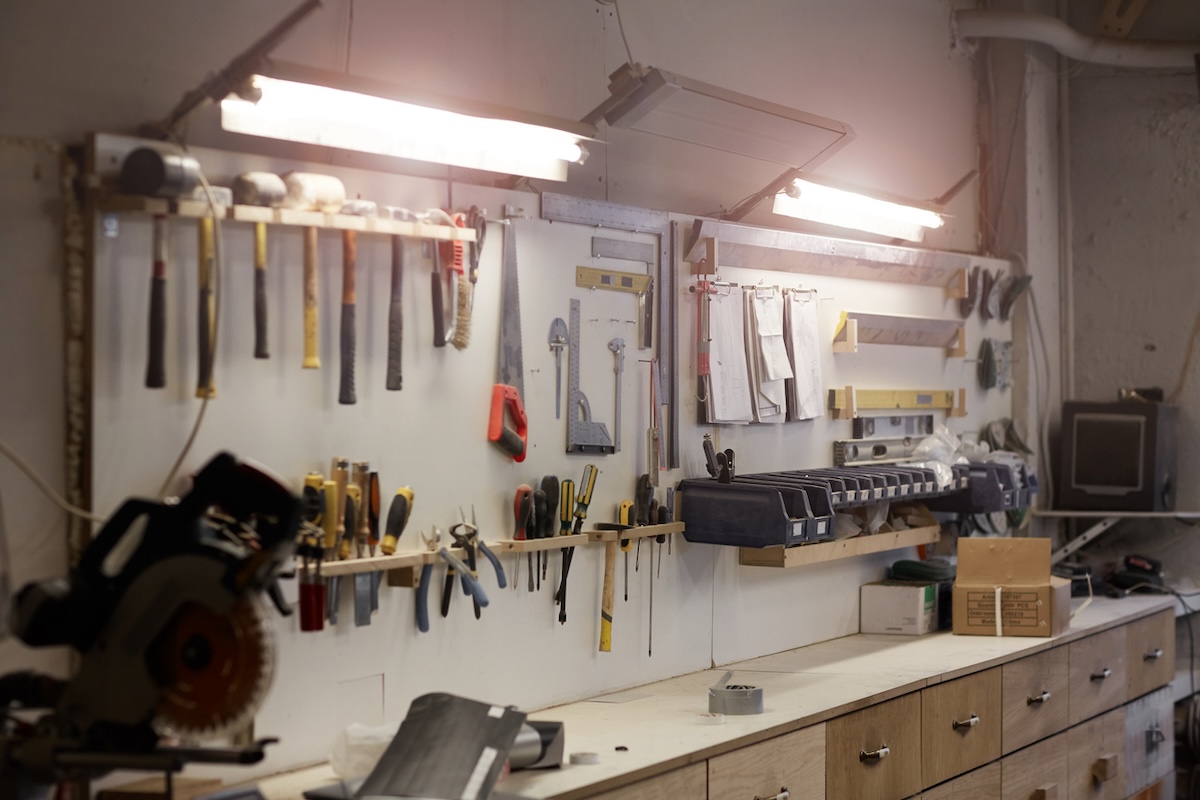 An organized home workshop in need of a DIY workbench.