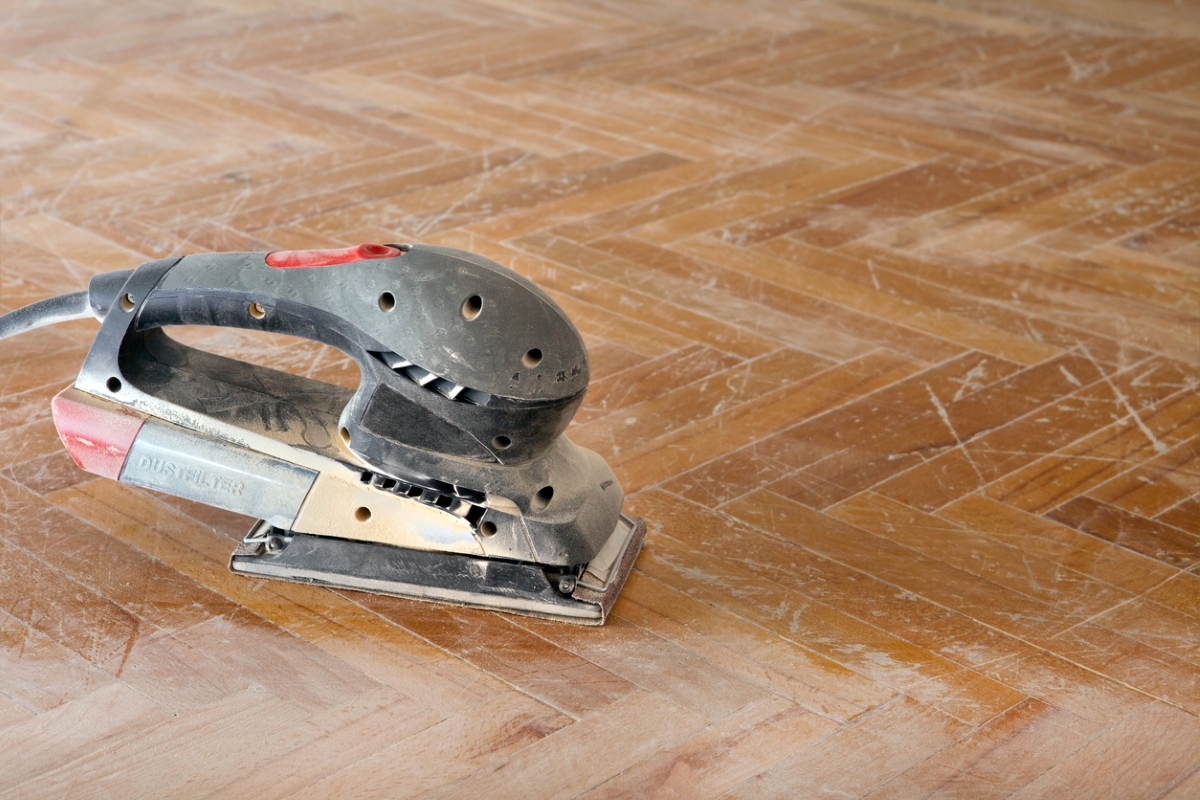 how to sand wood - power sander on older finished wood floor