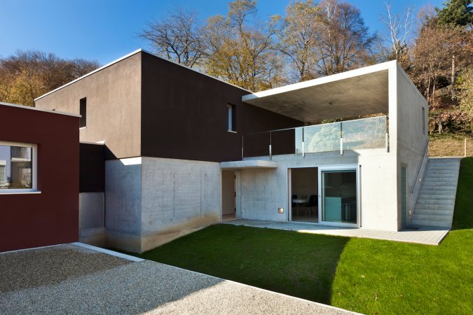 The exterior of a modern home is made of concrete.