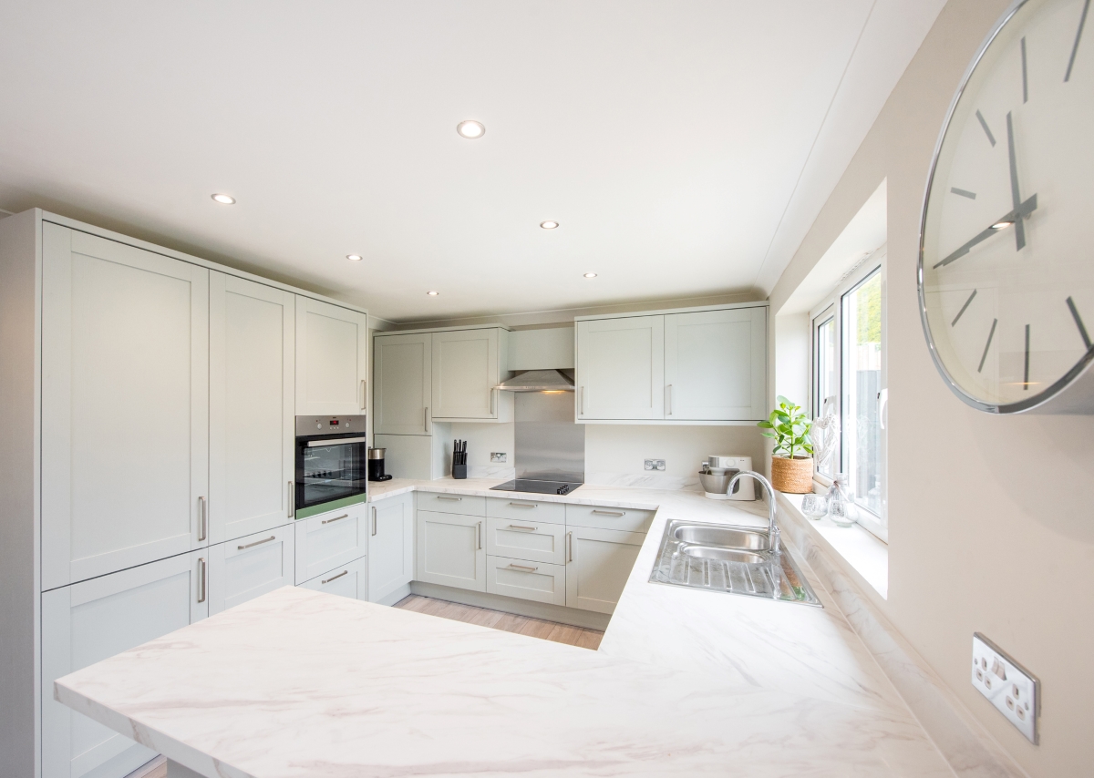White kitchen with marble effect laminate countertop