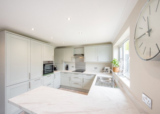 White kitchen with marble effect laminate countertop