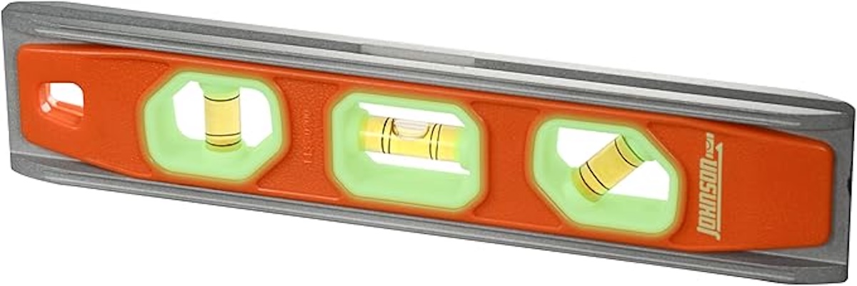 An orange, green, and yellow torpedo level from Johnson. 
