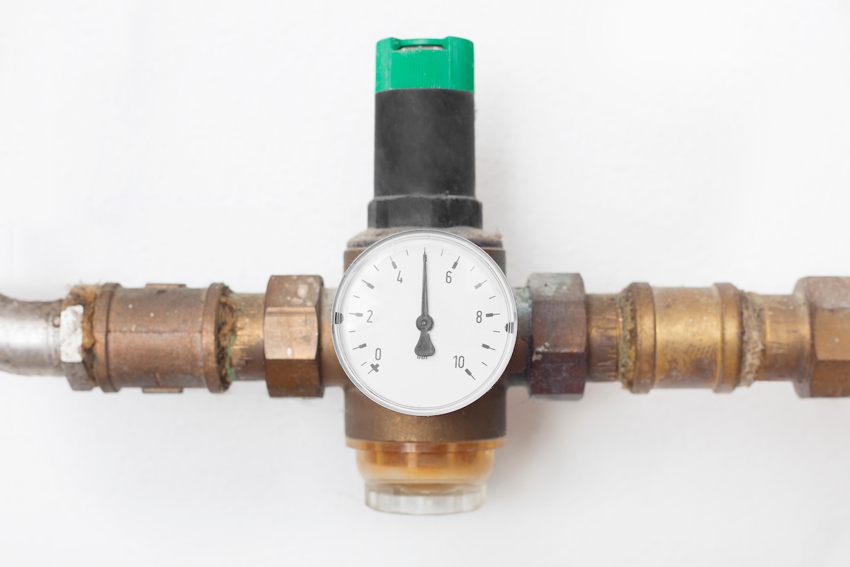 A water pressure reducer with a gauge indicator.