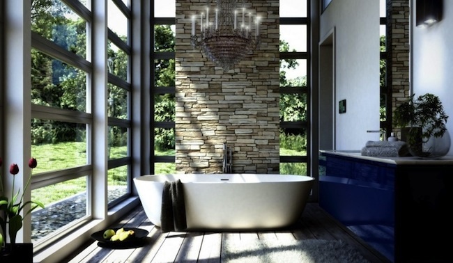 bathroom with stone wall and white tub