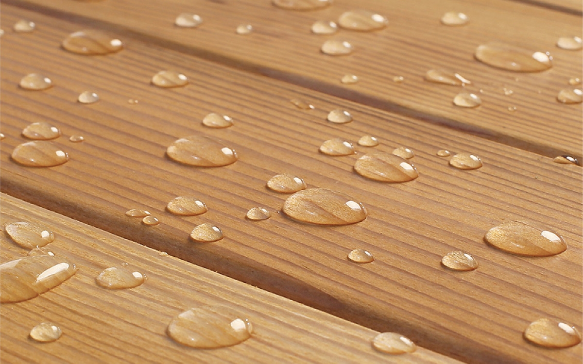 painting pressure treated wood - water drops on wood