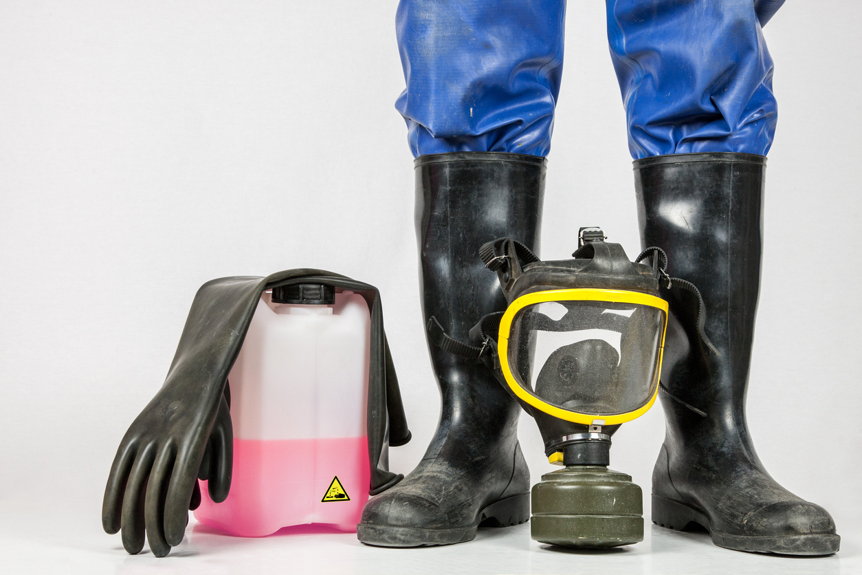 Five things for industrial cleaning. industrial cleaners, rubber gloves, rubber boots, gas mask and protective suit.