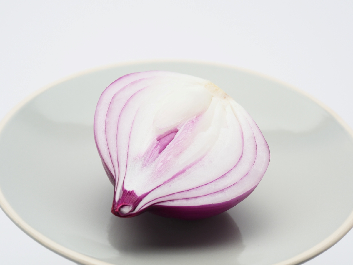 Half of red onion on plate