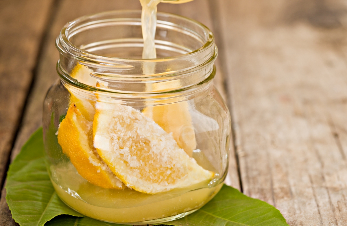 Lemon in clear jar with salt.