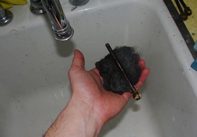 How to Fix a Squeaky Door - steel wool