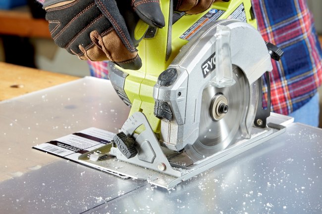 Close up of saw used to cut plexiglass.