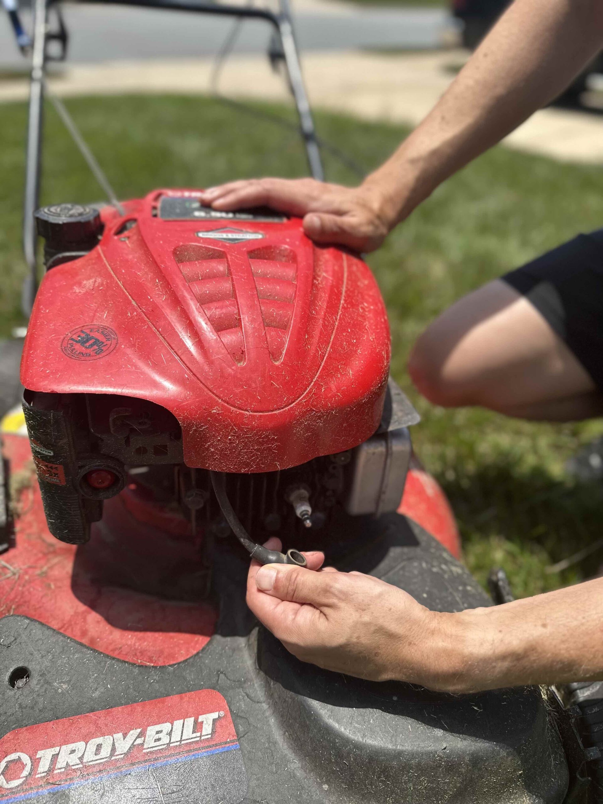 Removing sparkplug from lawn mower