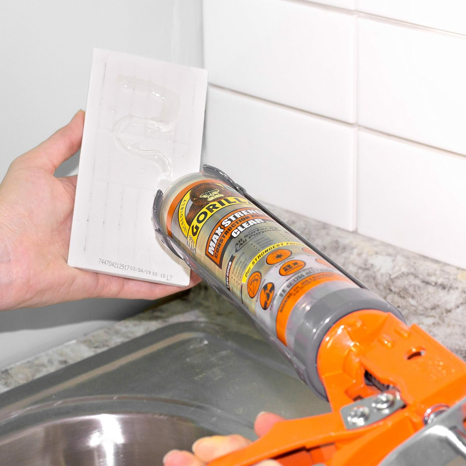 Applying Modified Silane Hybrid Adhesive to tiles in kitchen