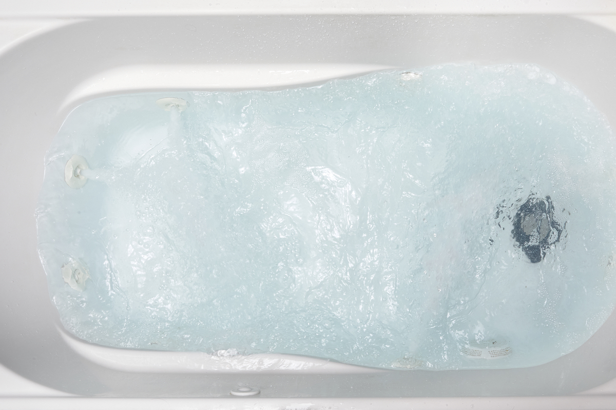 Running the jacuzzi water to clean it.