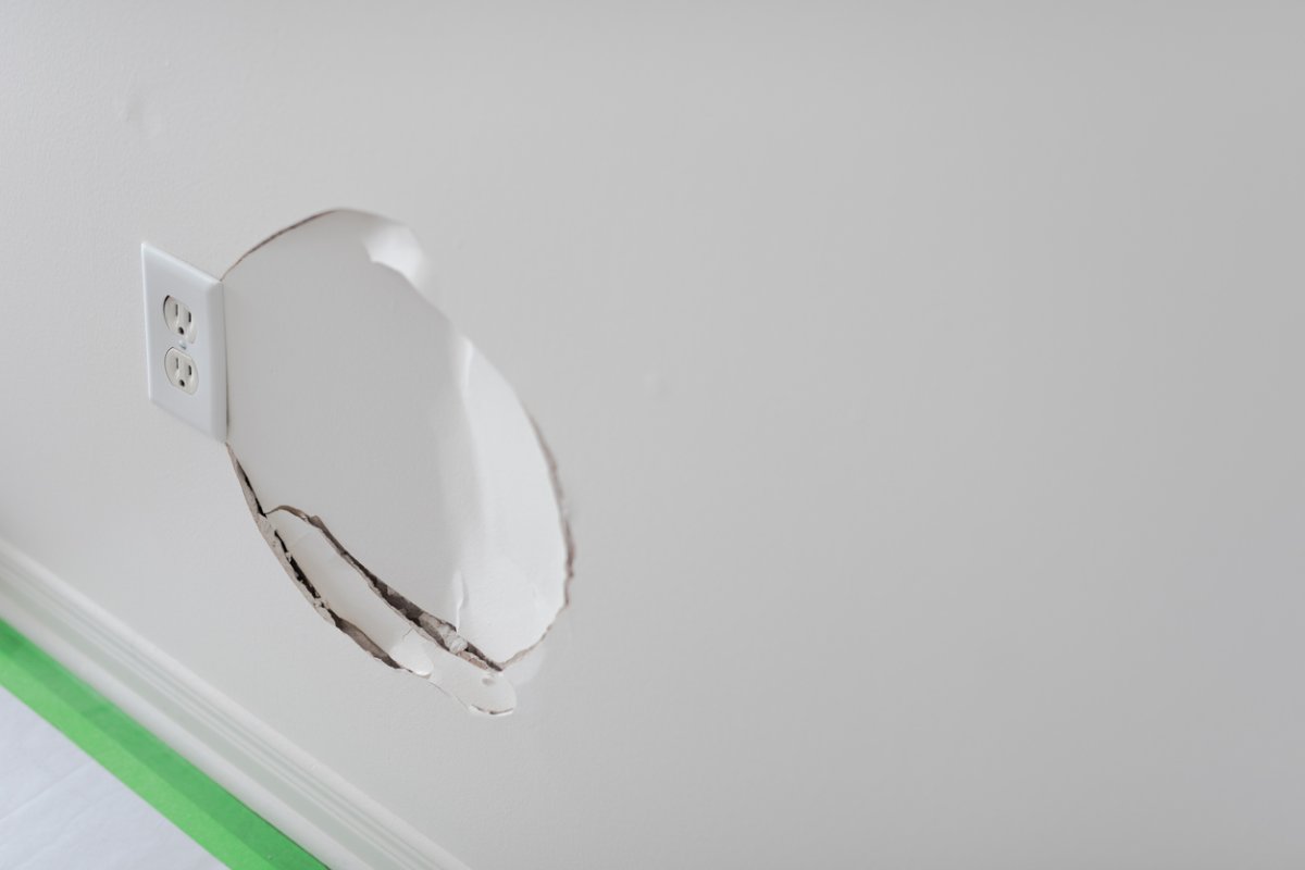 Large dented hele in drywall.