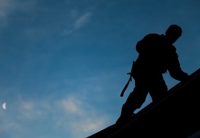 Installing a New Roof - Contractor Silhouette