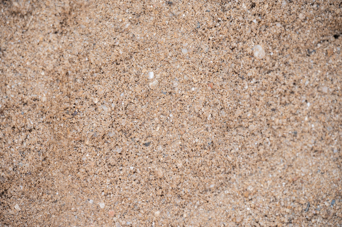Close up of light brown sandy soil