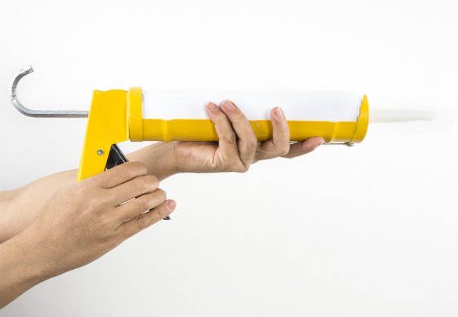 Fixing a Squeaky Floor with Construction Adhesive