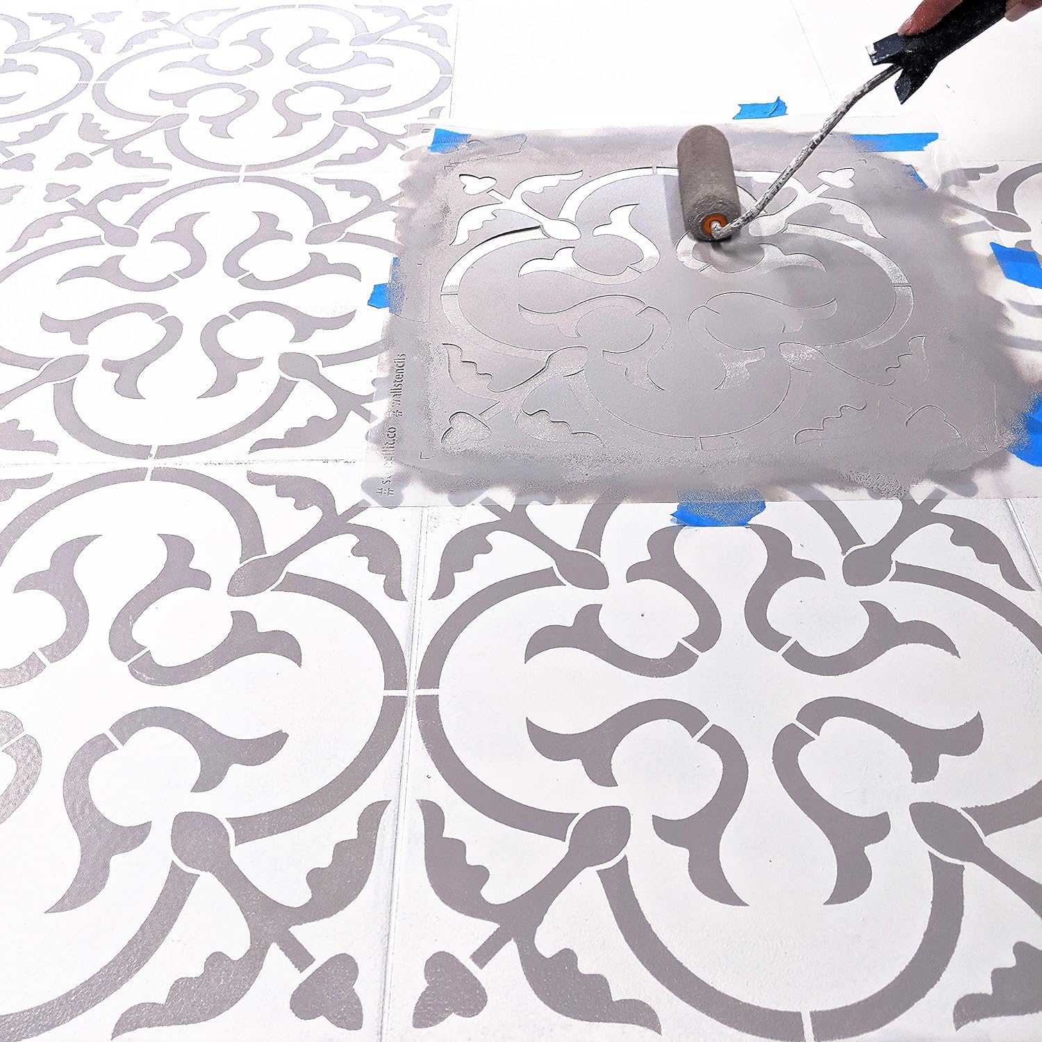 Applying paint using tile stencil