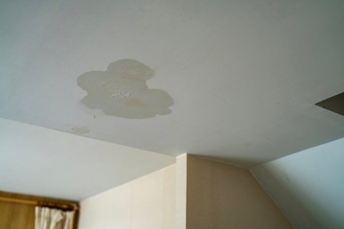 Water leak on ceiling of apartment unit.