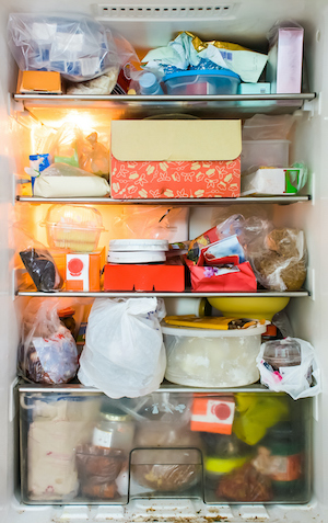 Refrigerator that is overstuffed with food