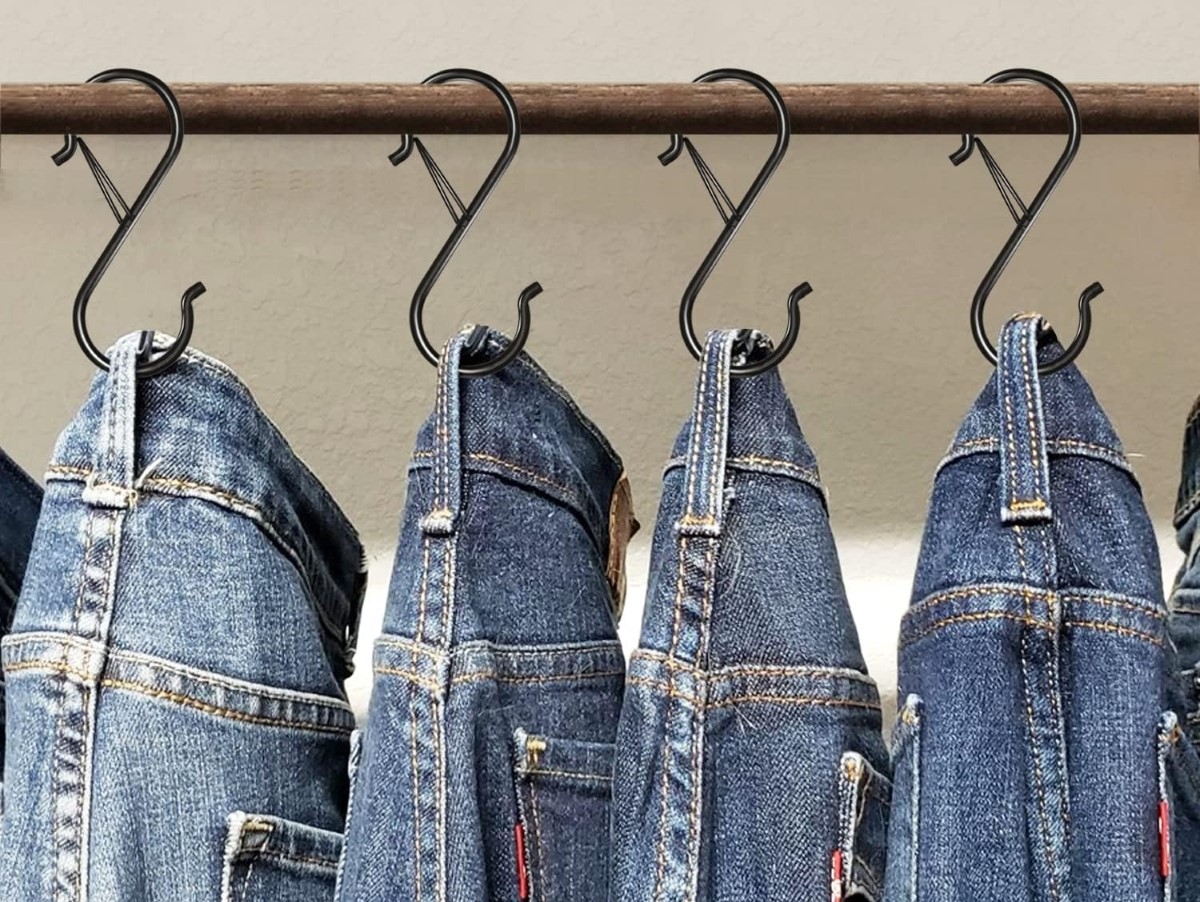 Jeans hanging from S hooks
