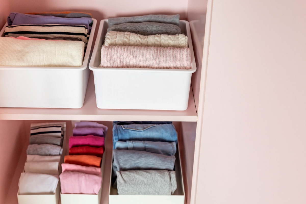 Clothes folded in organizer bins