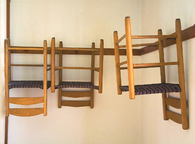 Shaker Style Chairs Hung on the Walls