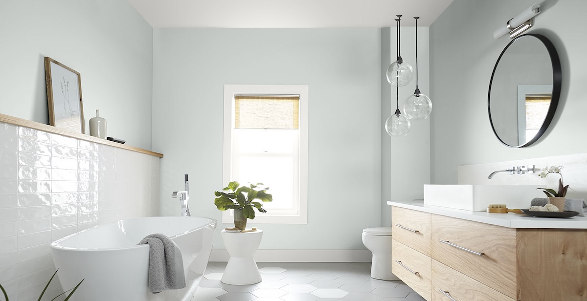 A bathroom with light, cool-toned grey walls with a semigloss finish. 