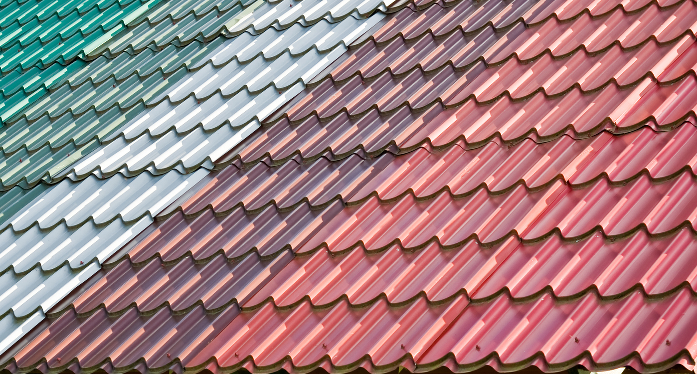 Different colourful copper stripes of tiled roof on a new roof