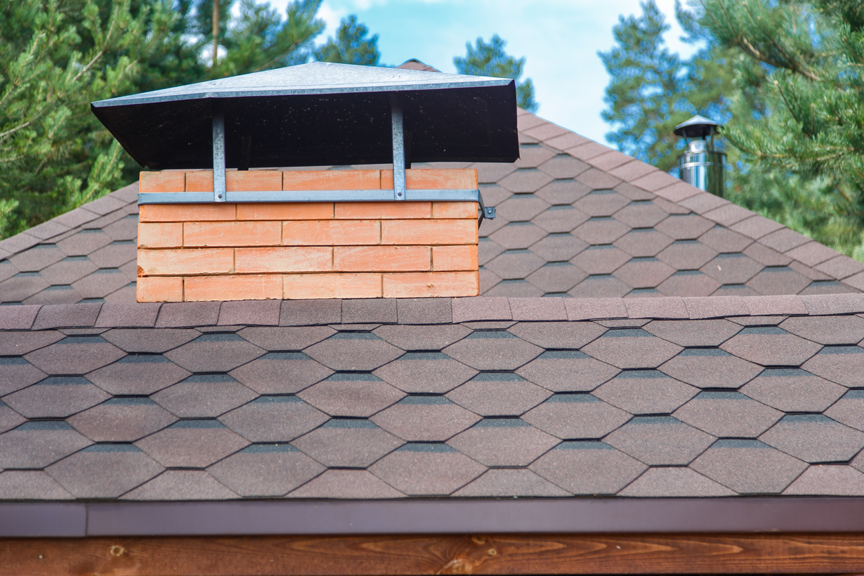 Modern roofing and decoration of chimneys. Flexible bitumen or slate shingles. The absence of corrosion and condensation due to the flexible roof