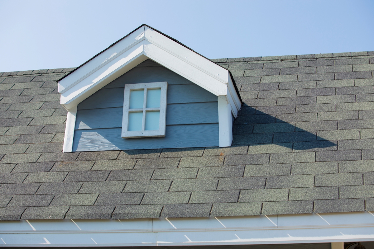 3 tab shingles on roof with window.