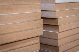 Side view of stacks of laminated MDF boards.
