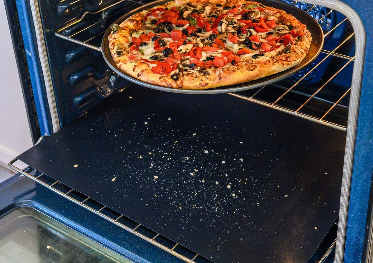 Amazon Cleaning Tips for Electric Ovens Oven liner on bottom rack of electric oven with pizza on top rack.jpg