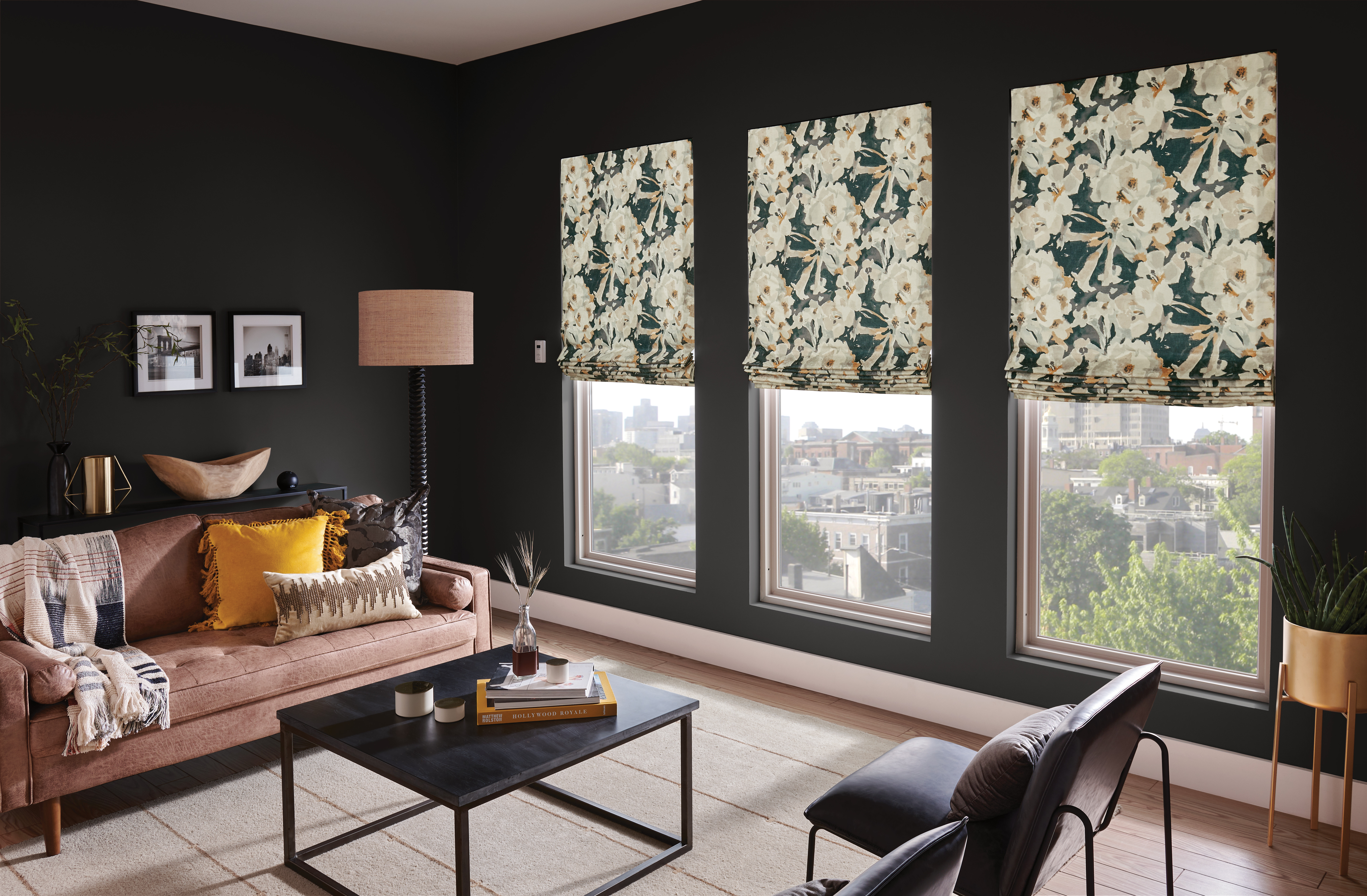 A dark room with patterned window dressings that block out the cityscape sounds below.