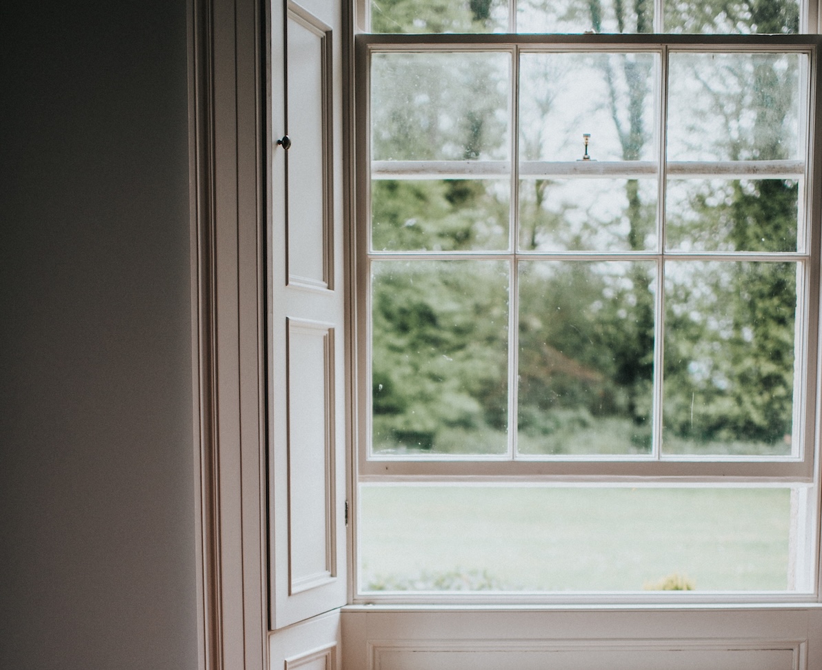 Beautiful old open window, looking out at country view.
