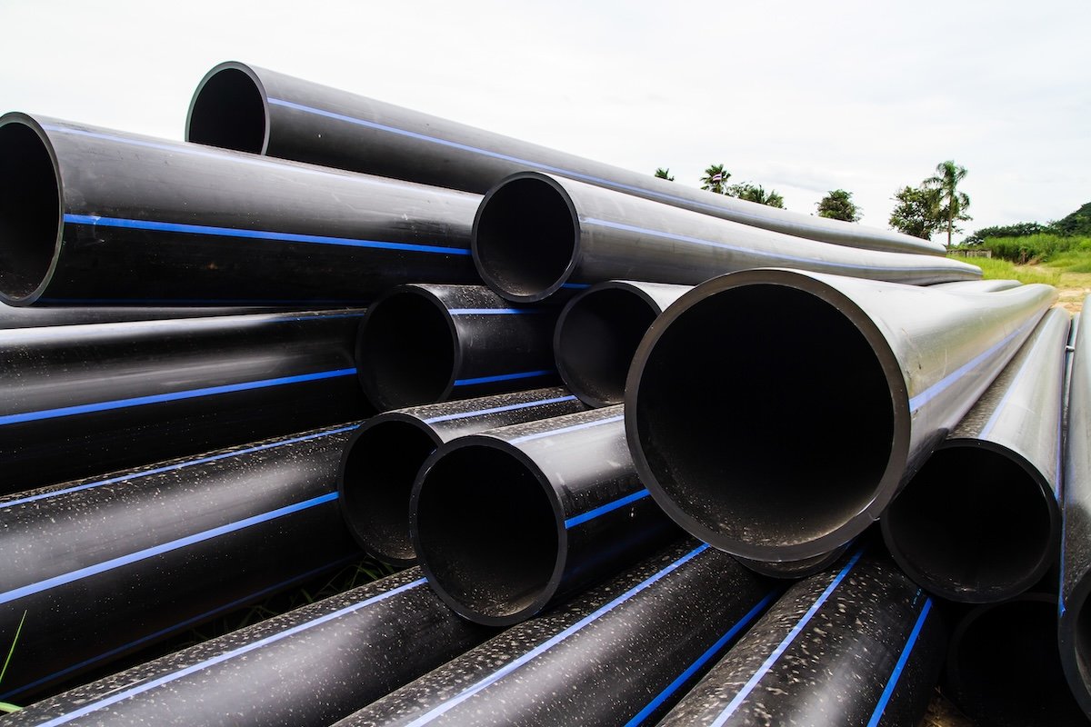 High-Density Polyethylene Pipe layered atop of each other for storage.