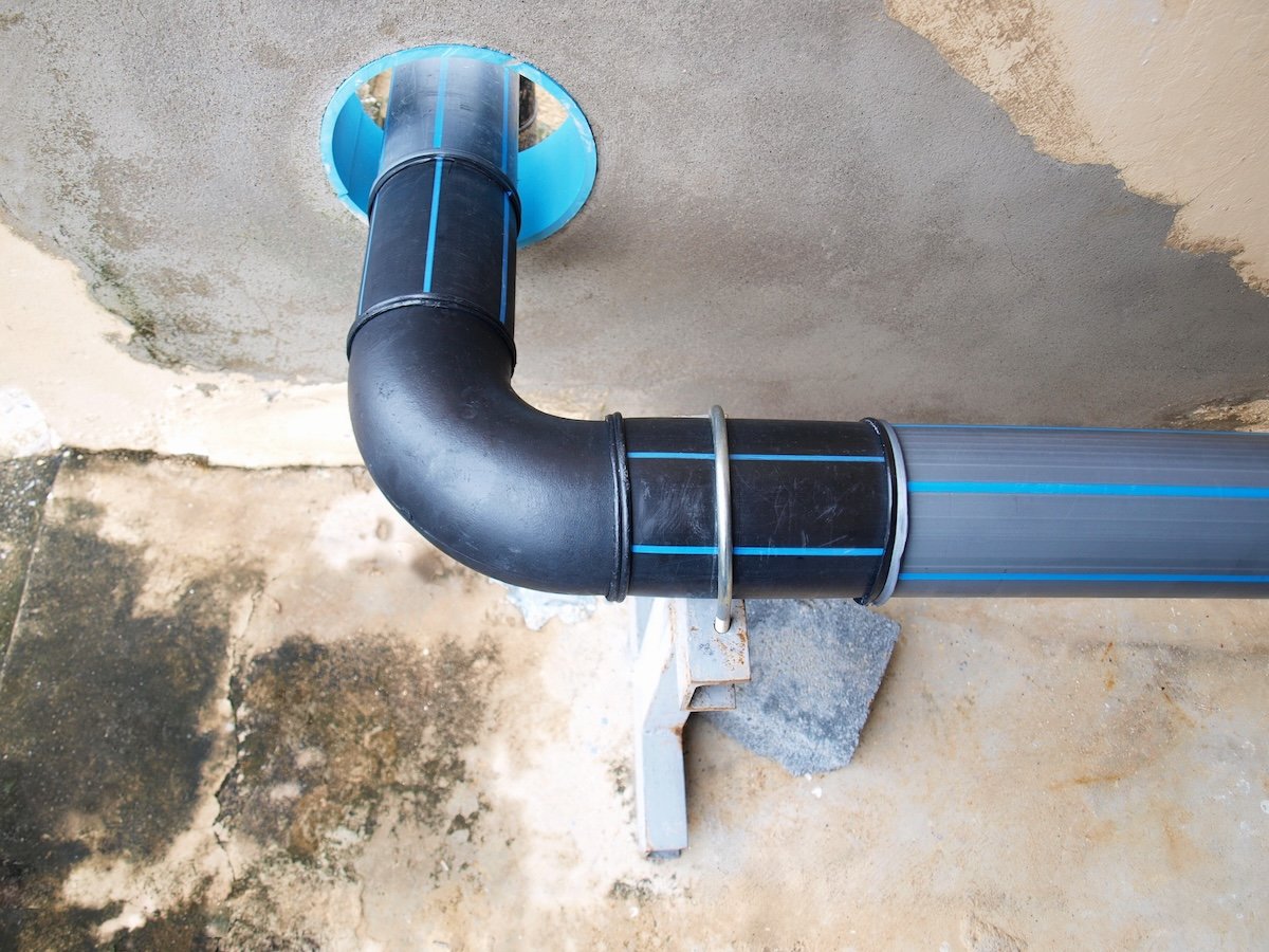 Blue and grey Polybutylene Pipe in a plumbing system. 