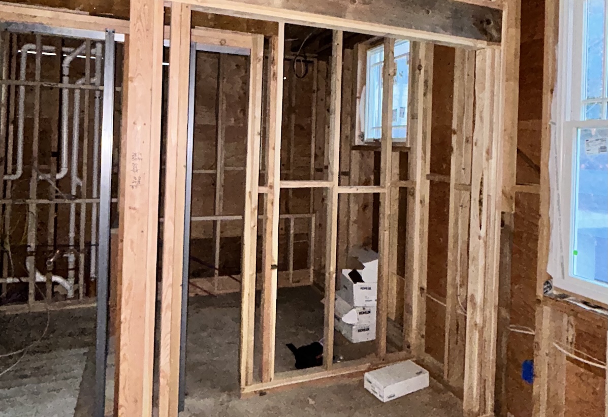 Interior of house with wood framing done but no drywall up.