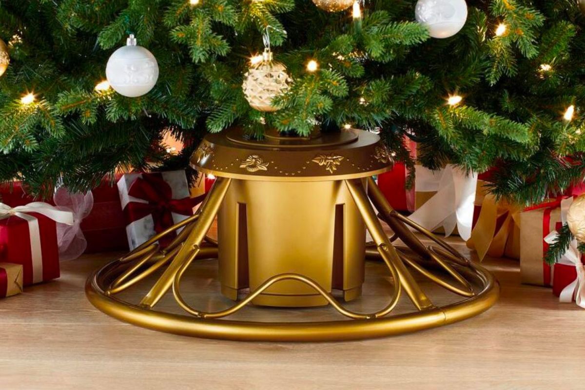 The Best Christmas Tree Stand Option supporting a decorated Christmas tree with a few presents around it.