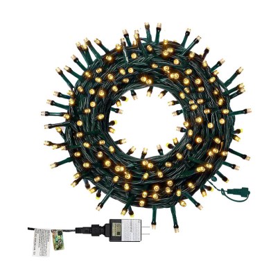 The Twinkle Star 66-Foot 200 LED Christmas String Lights and its plug turned on and rolled up on a white background.