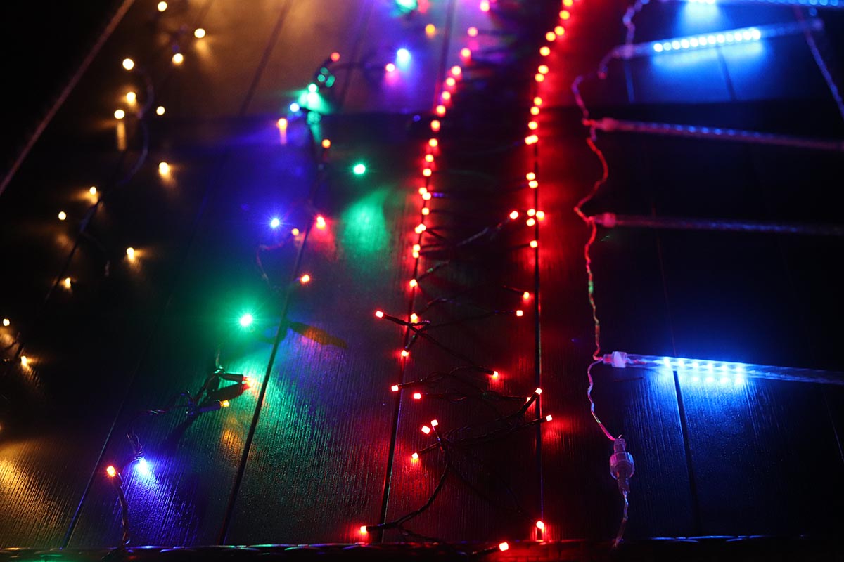Several strings of the best Christmas lights side by side during testing.