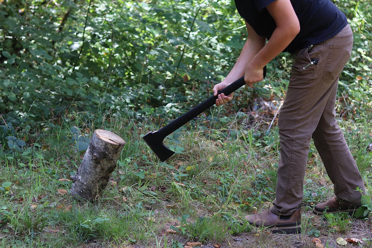 A person using the best axe option to split a log