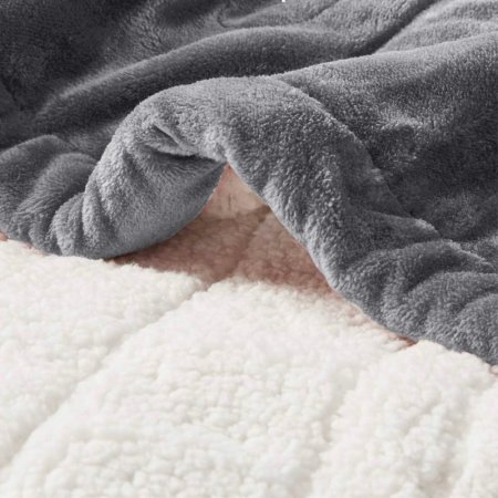  The Degrees of Comfort Fuzzy Sherpa Heated Blanket displayed to show both its sides: soft grey and fuzzy white.