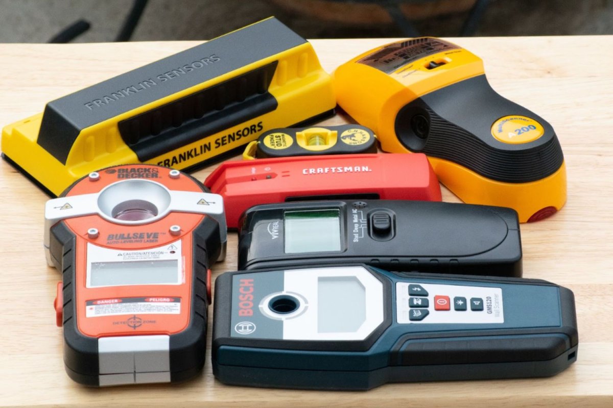 The 7 best stud finders on a workbench before testing.
