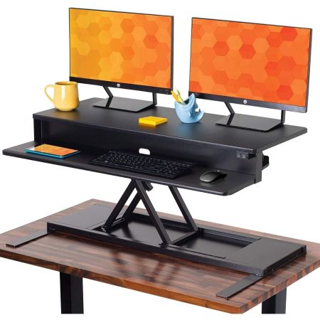 Stand Steady Flexpro Power 电动站立式办公桌,白色背景上配有两个显示器