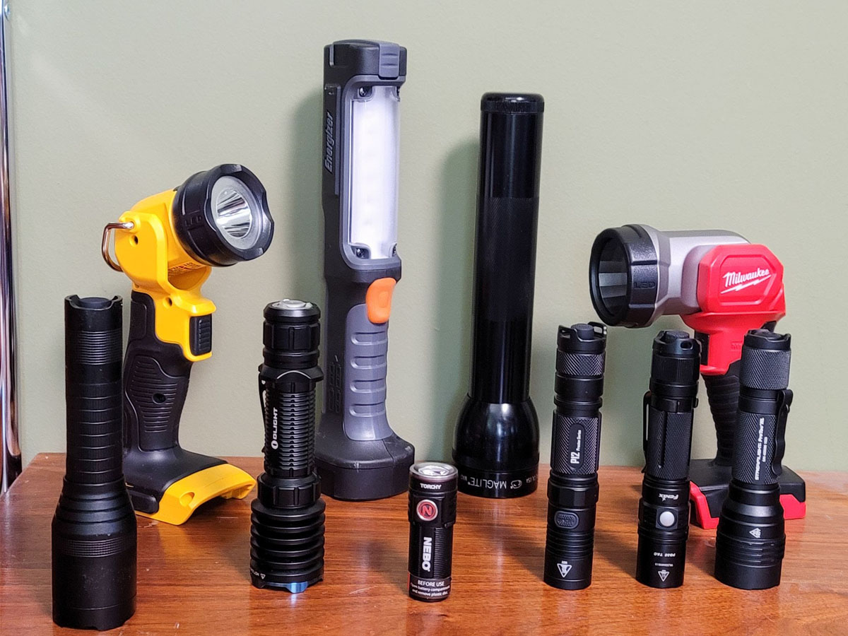 A group of the best flashlights together on a table before hands-on testing.