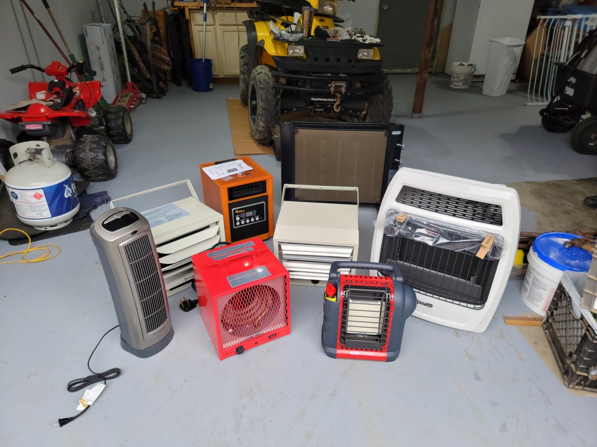 The Best Garage Heater Options grouped together on a garage floor